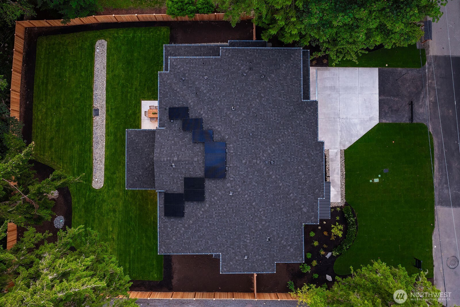 This home contains solar panels. The photo shown above is from a different MN Custom Home with a similar solar arr