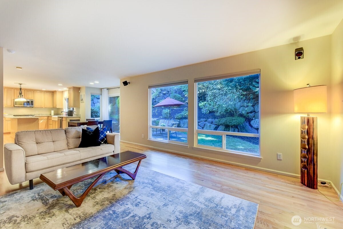 Large family room open from main kitchen with built-ins and gas fireplace! Samsung Smart TV Stays.