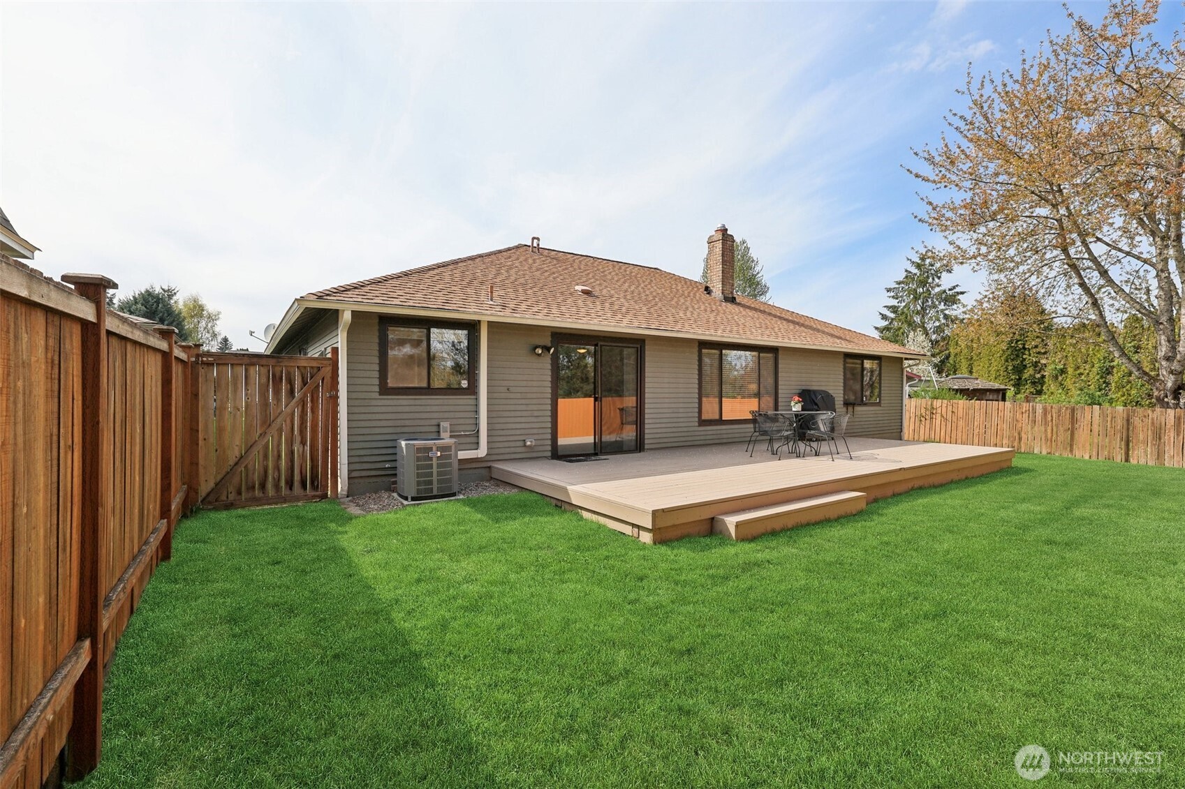 New deck overlooking a fully fenced backyard