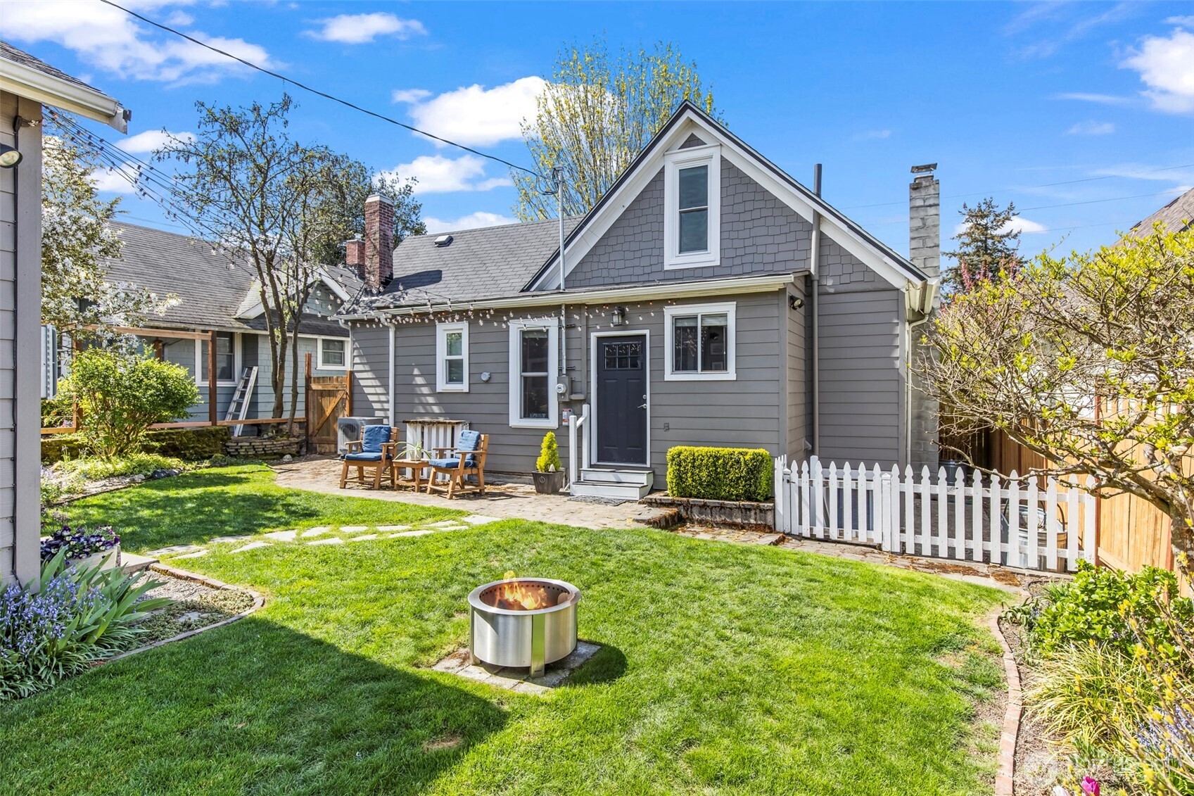Relax in the back! Private, fully fenced back yard (new fence was being installed on the same day as photography)