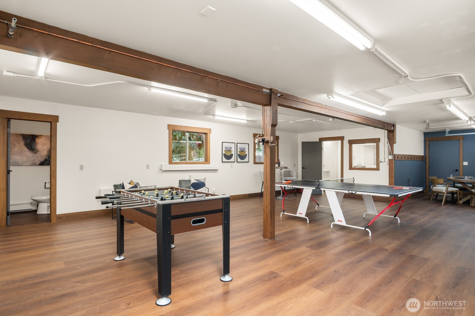 Rec room with additional laundry/utility space. Currently plumbed for air compressor.