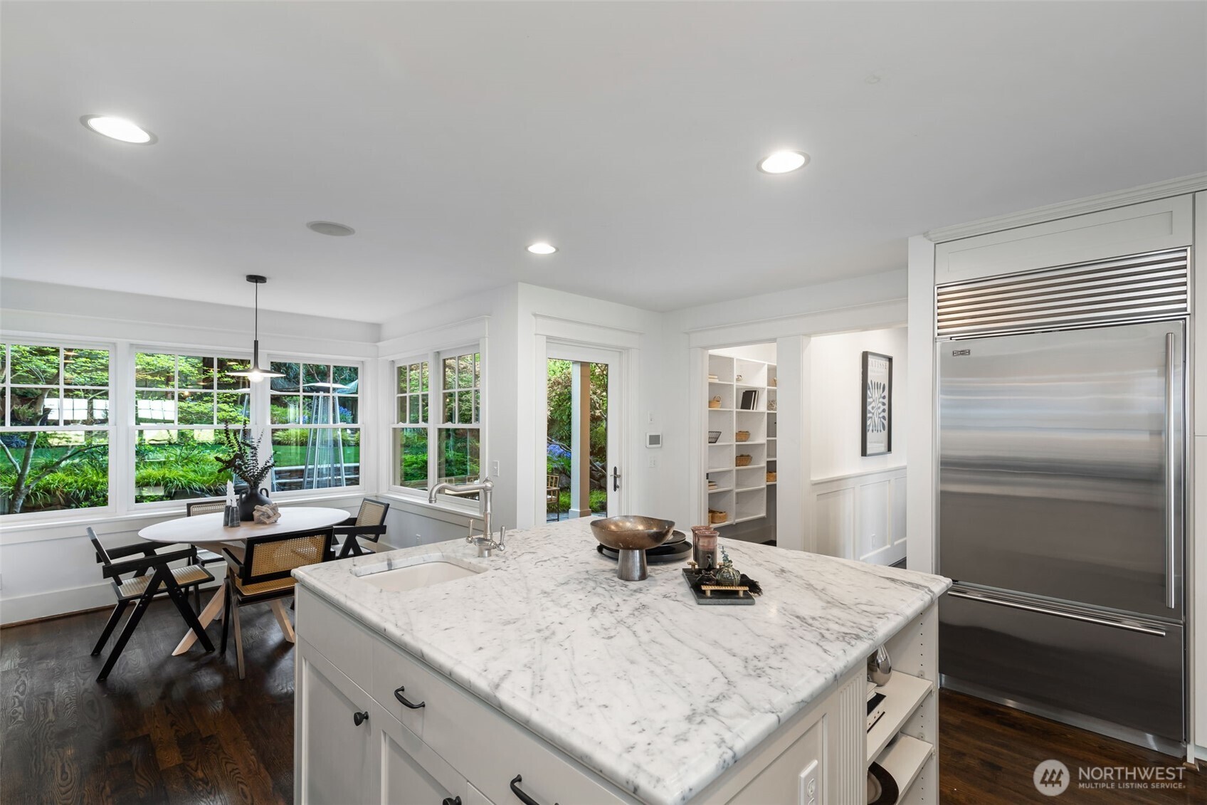 Both dining room and kitchen have access to the backyard.