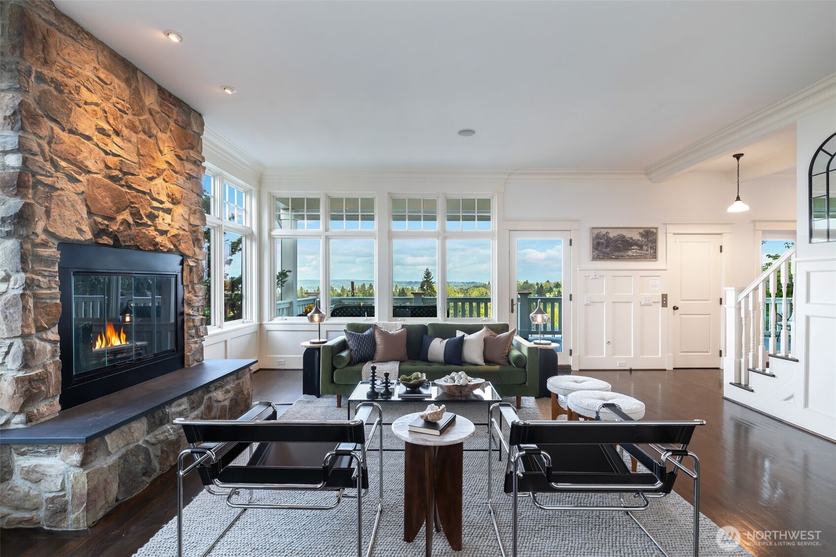 One of two living spaces here, both enjoying incredible eastern views with a wood burning fireplace.