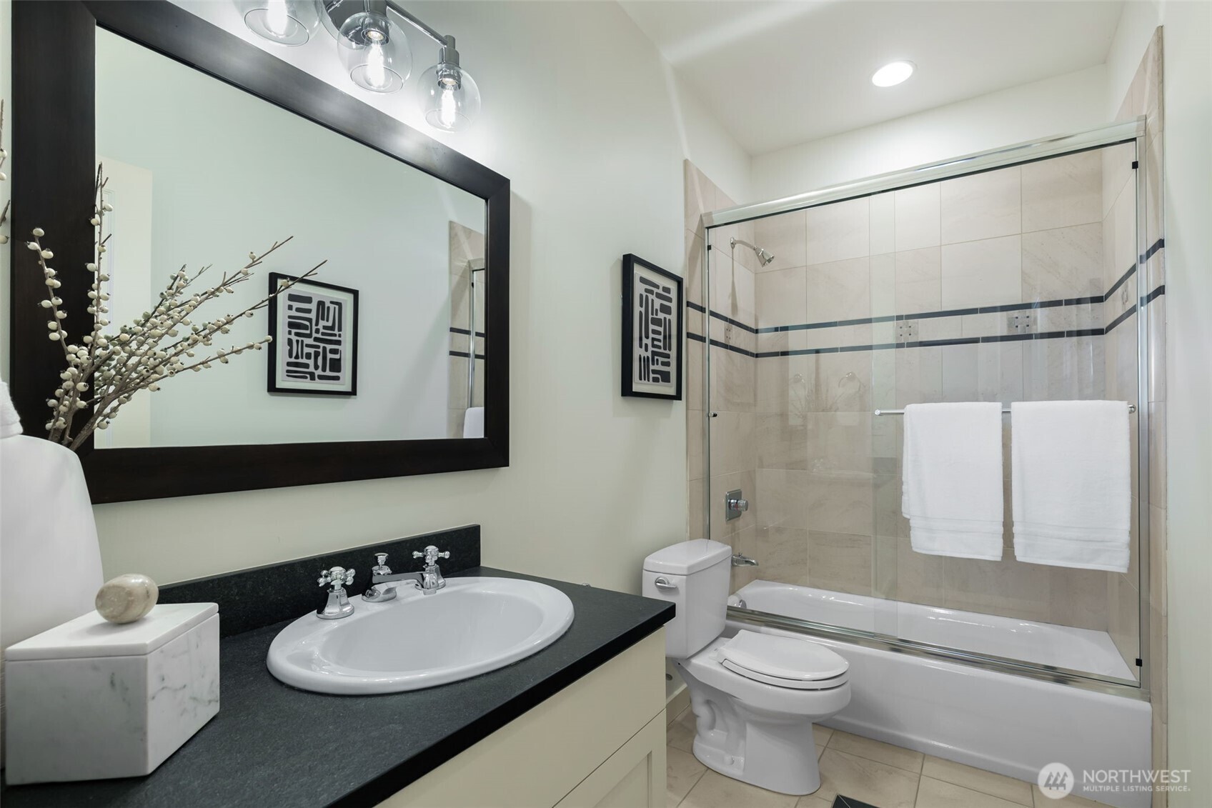 Full bath on the first floor adjacent to the guest room, office and media room.