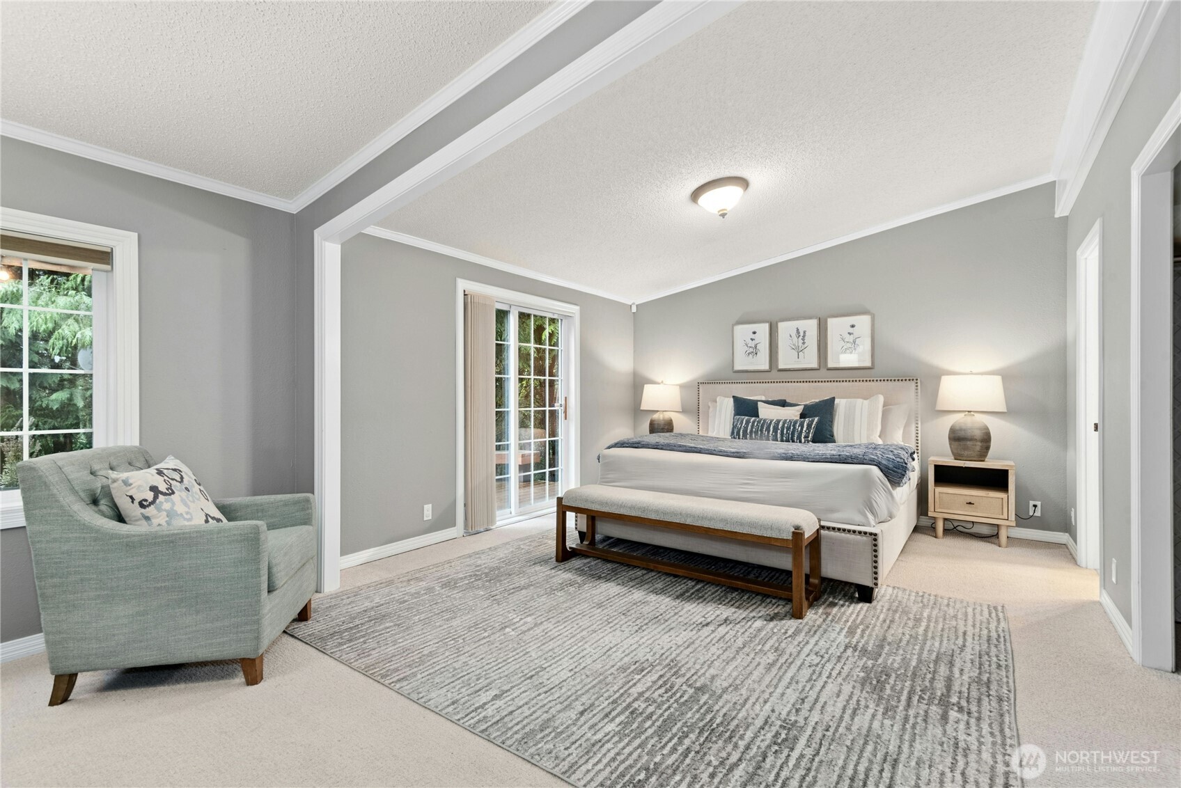 Oversized Primary bedroom with access to deck, en-suite 5-peiece bath, walk-in closet with custom closet organization!