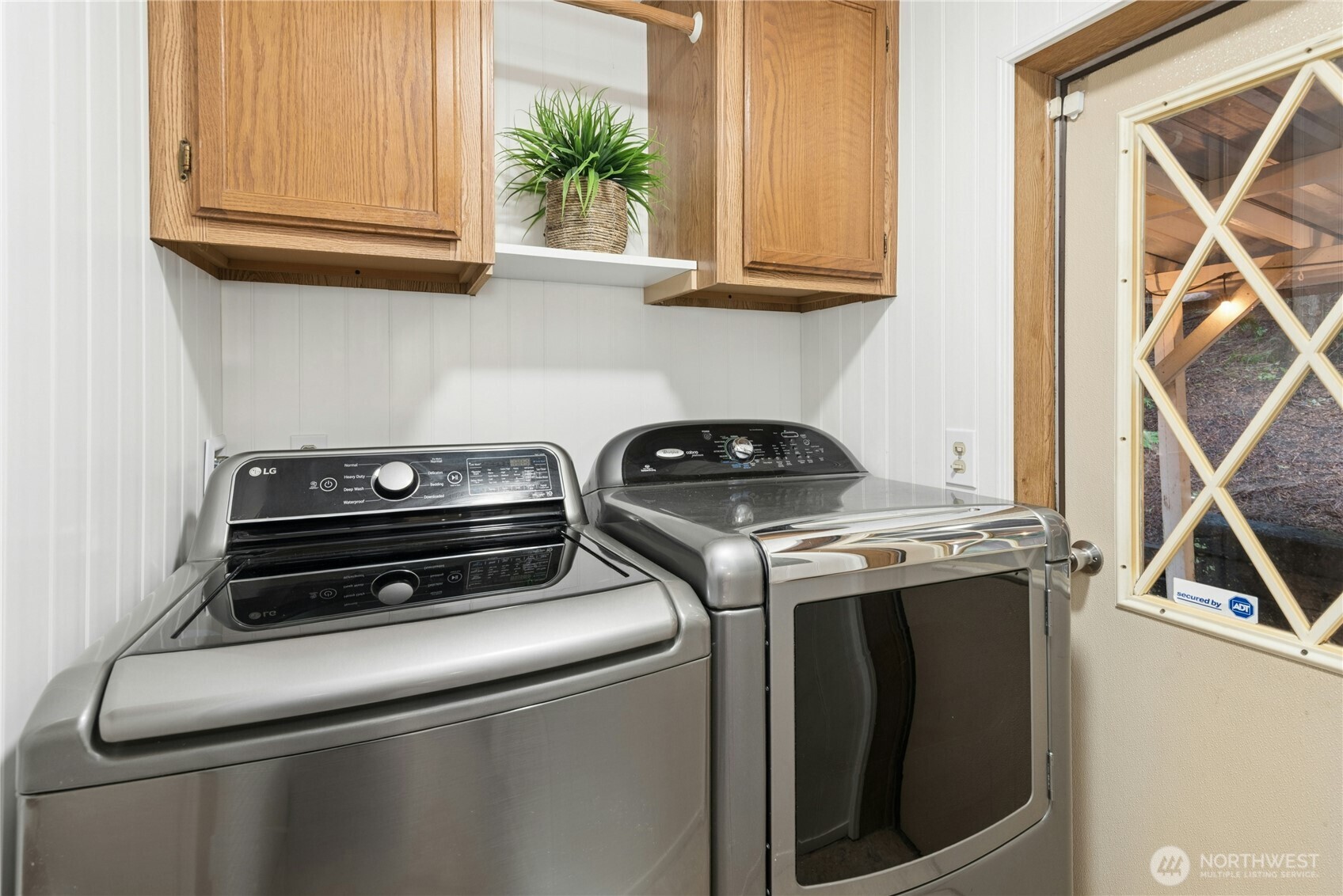 Mudroom with door to covered patio.