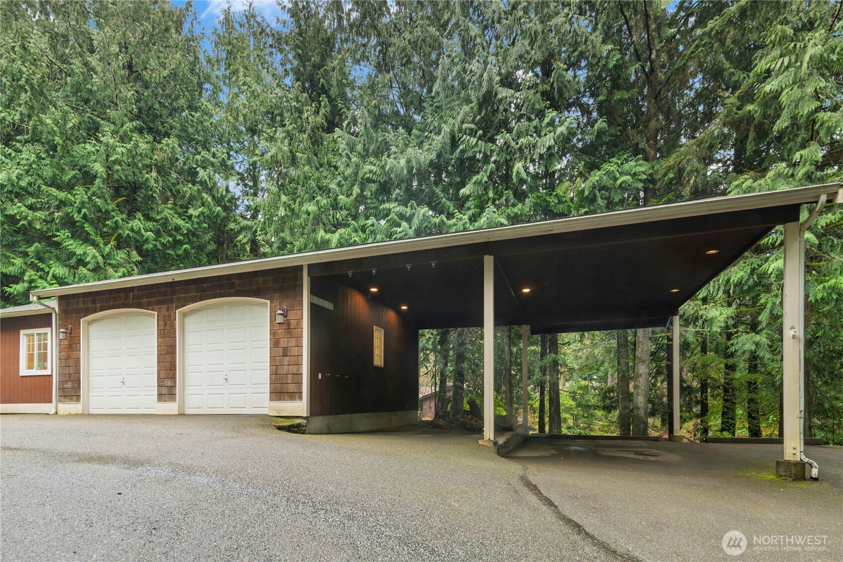 Detached garage, with oversized garage doors, and extra tall covered parking!