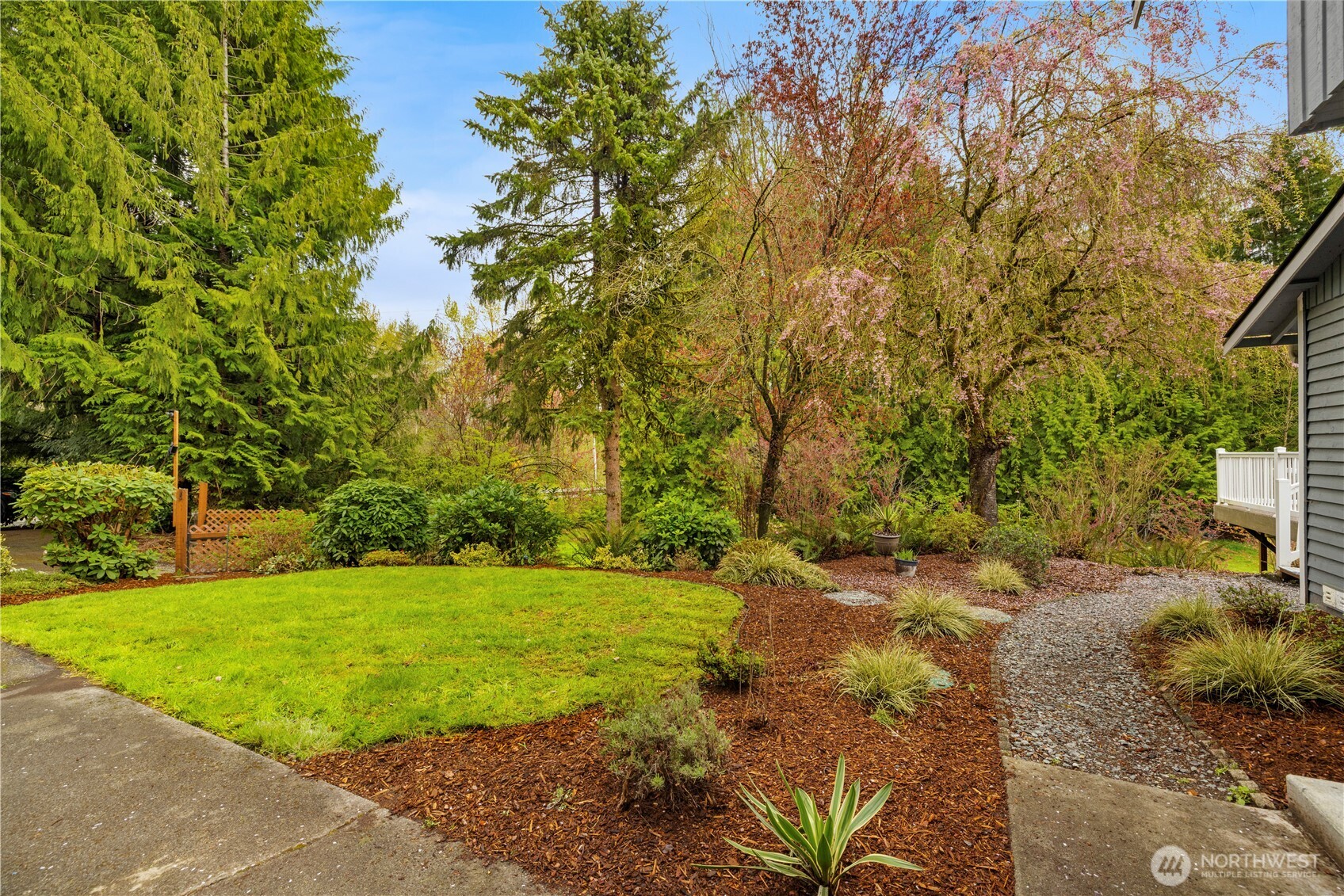 over 1 acre of beautifully landscaped grounds