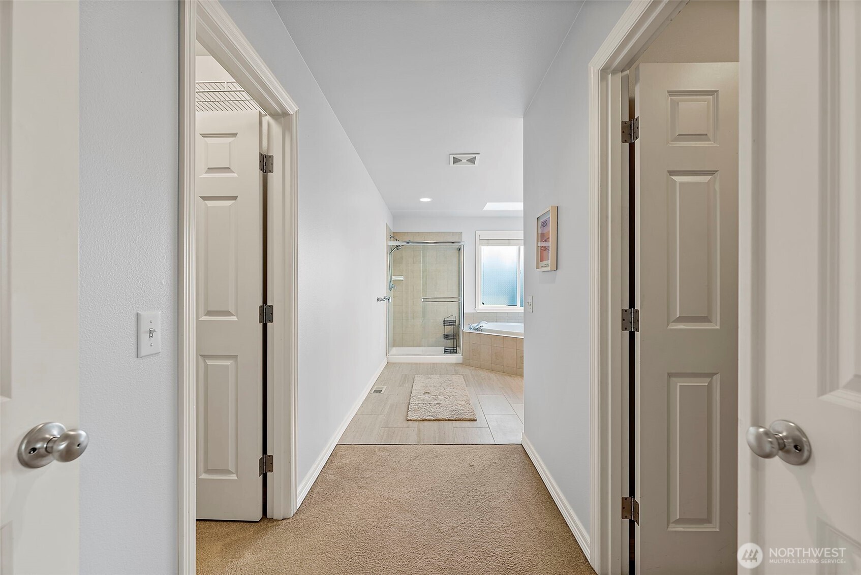 Second of 2 walk in closets in primary bedroom