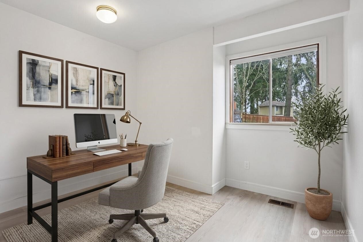 Main floor bonus room. Virtually staged