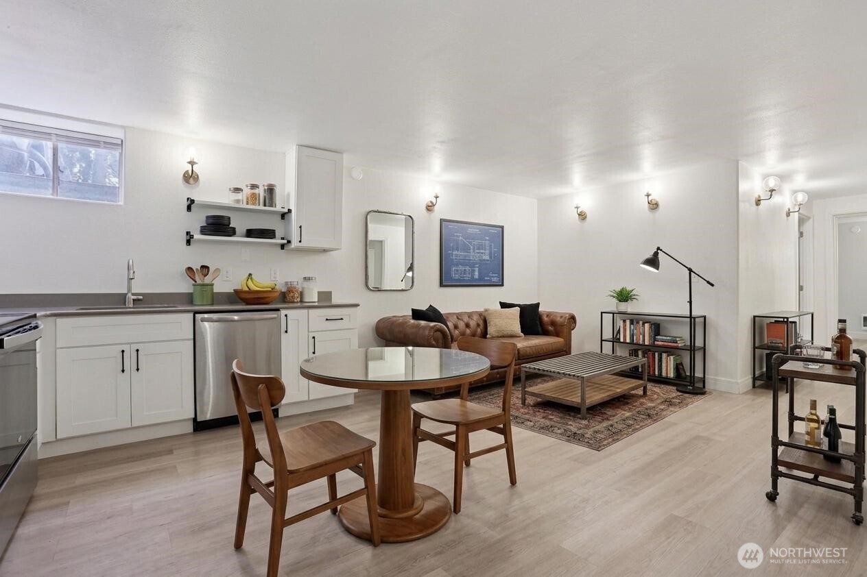 Basement apartment living room and kitchen. Virtually staged