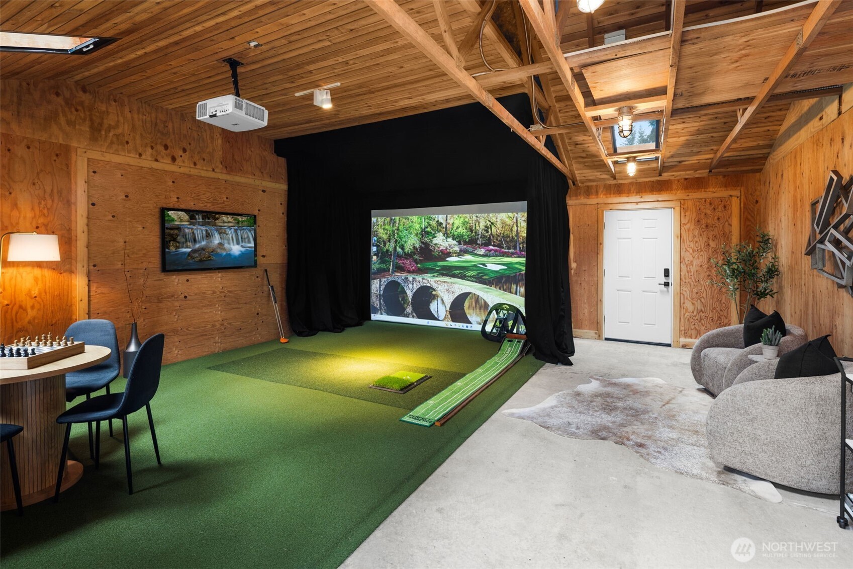 Golf Simulator and space to lounge and entertain.