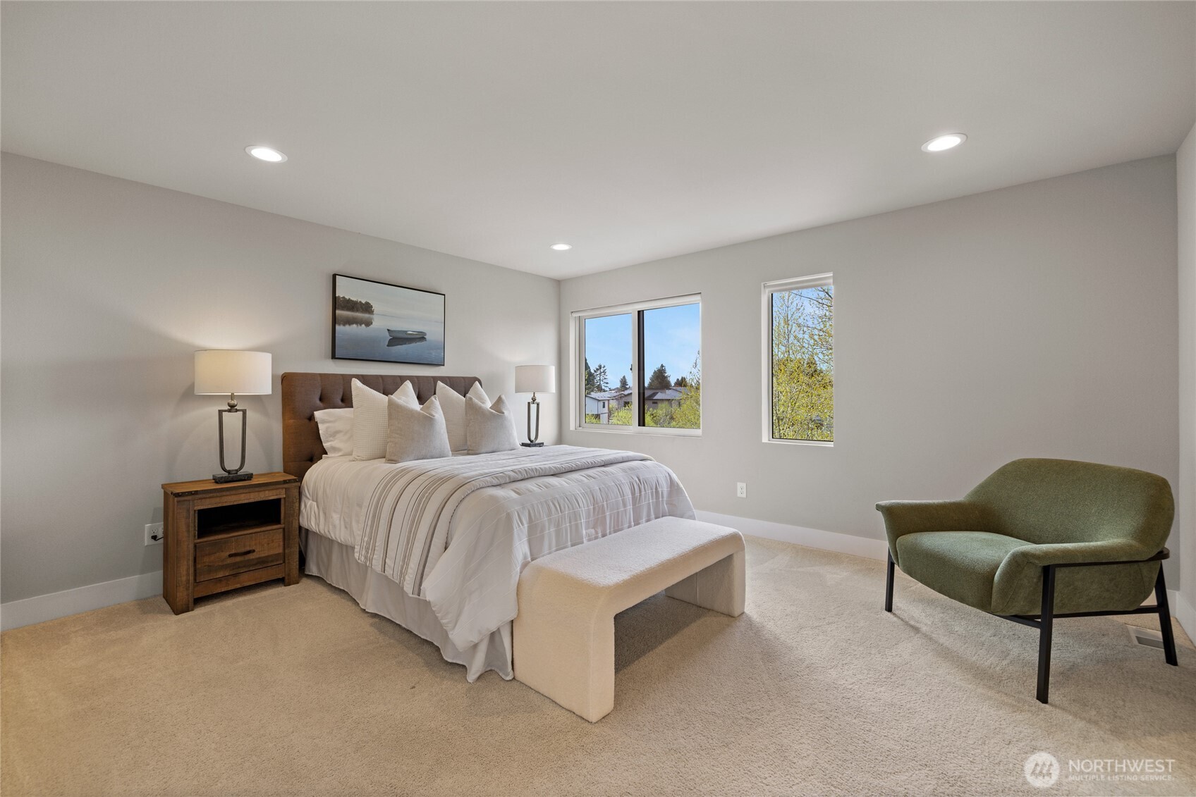 Primary bedroom w/ ensuite bath.