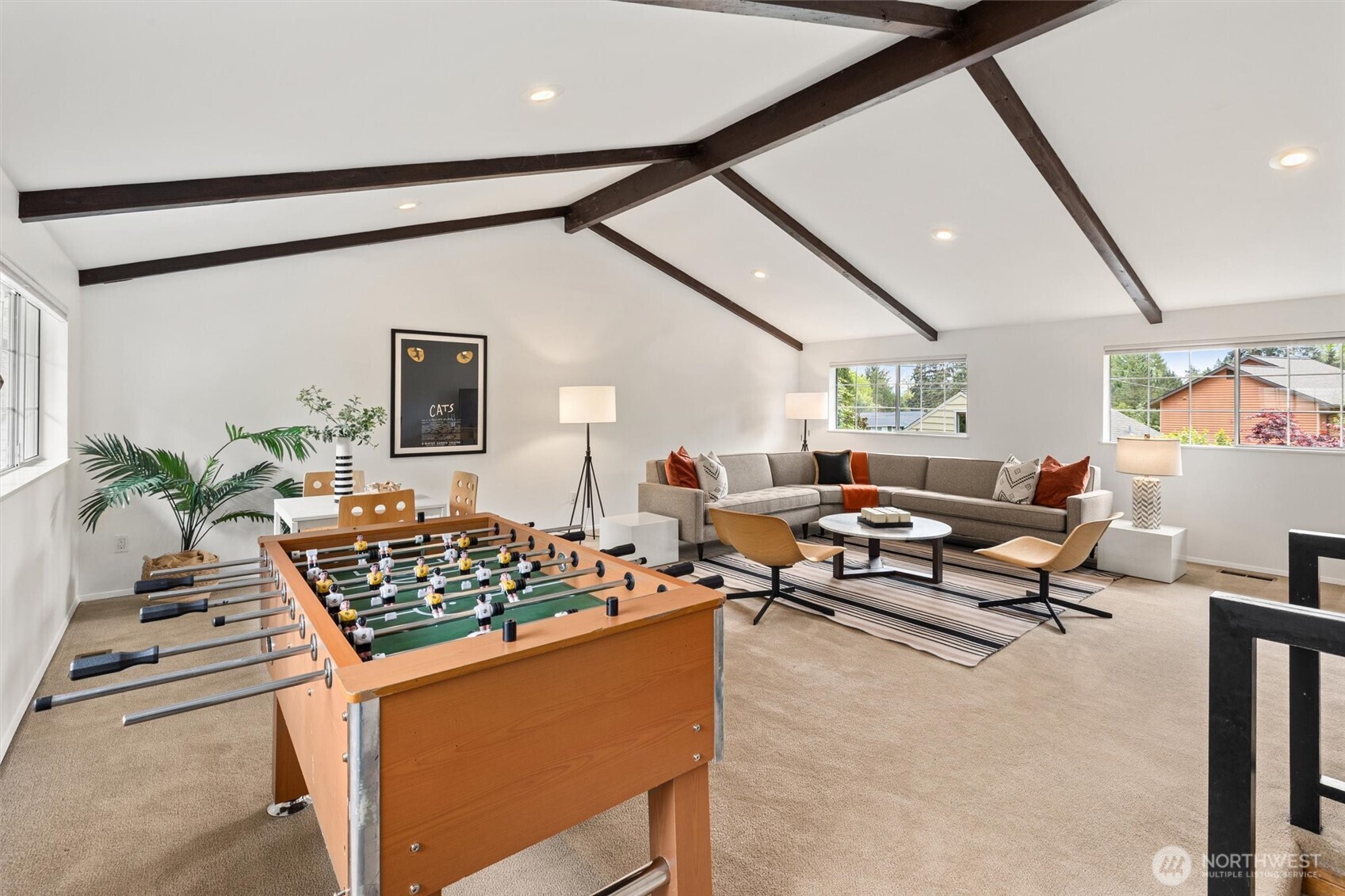 vaulted bonus room creates the perfect flex space for media room, playroom or work out space