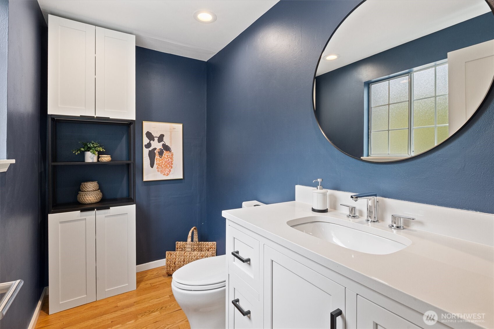 The main-level half bath includes laundry hookups, offering the option to add a second set.