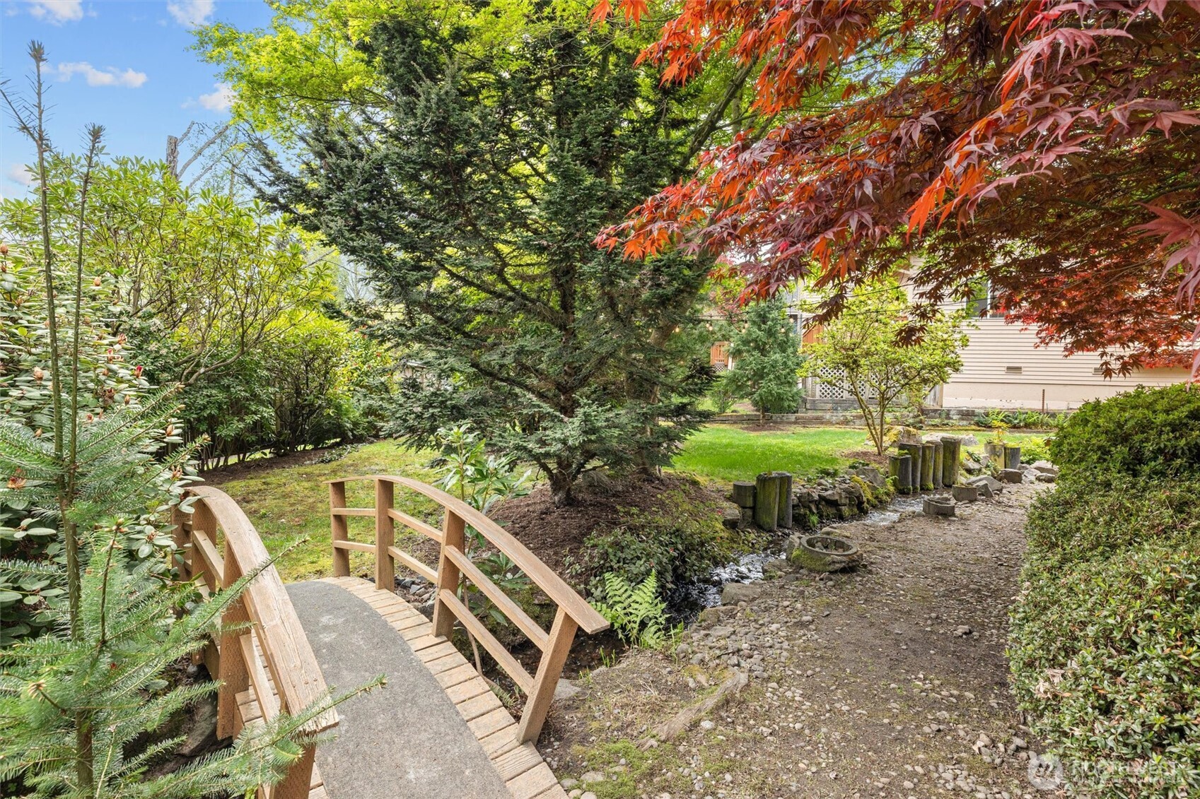 A natural creek winds through the property, creating your own tranquil retreat