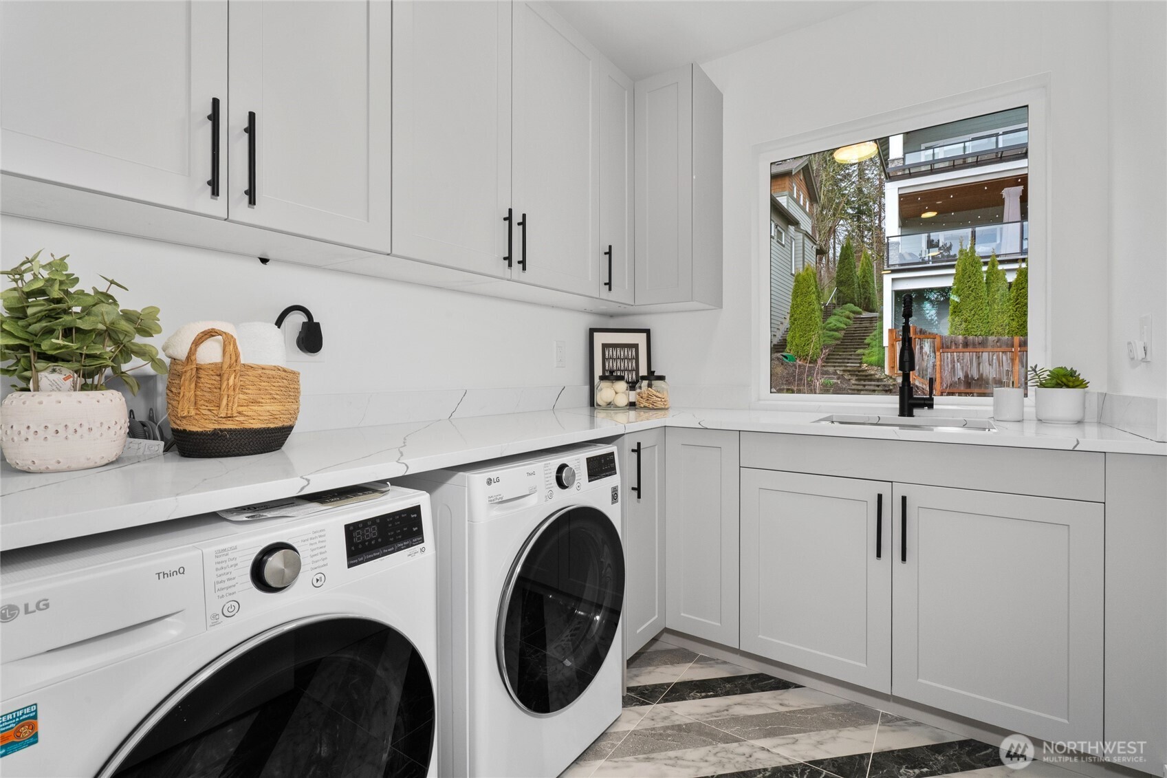 Laundry room upstairs with sink