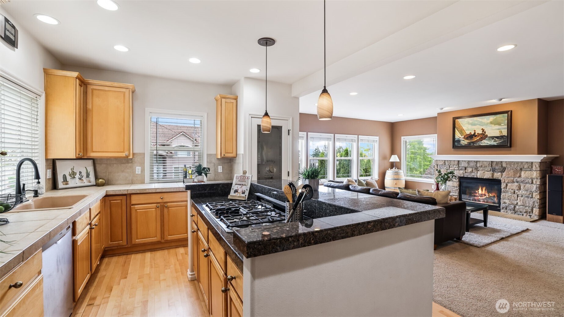 Granite island with premium gas cooktop—perfect for culinary creativity and effortless entertaining.