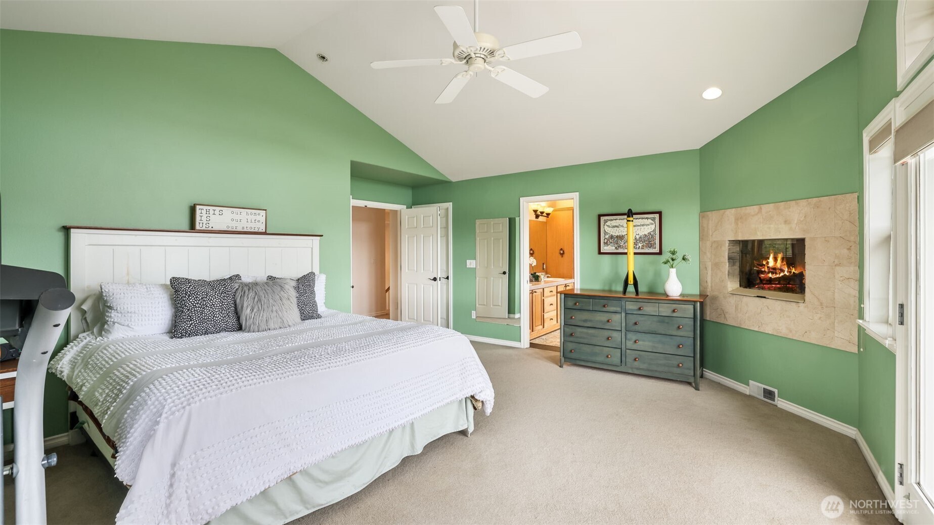 Ample space in the primary suite for your own private lounge or reading nook.