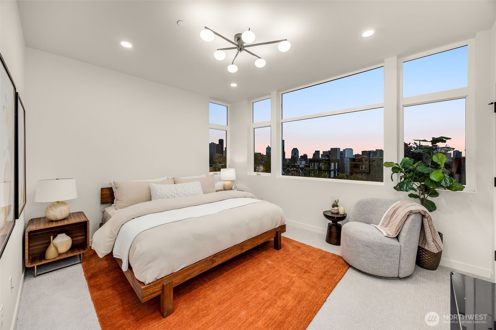 The primary bedroom offers phenomanal views of the city