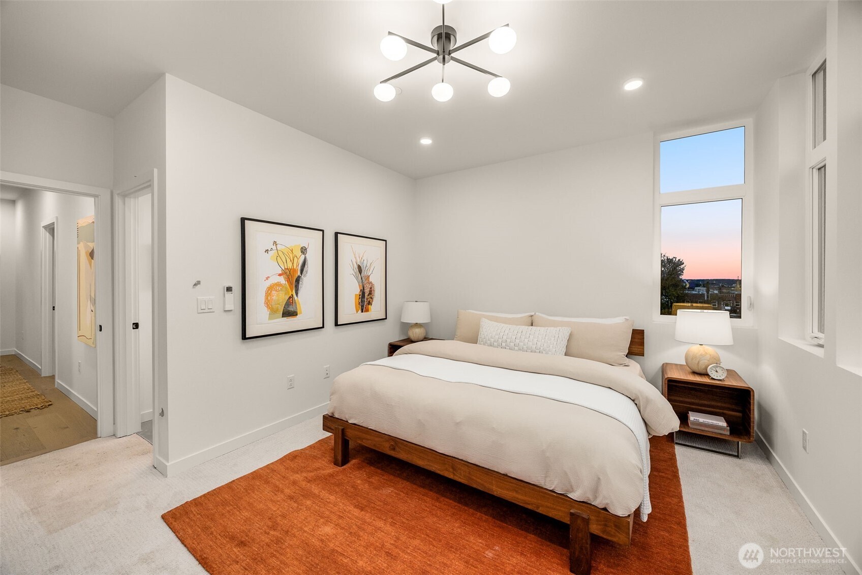 The primary bedroom hosts an en-suite bath