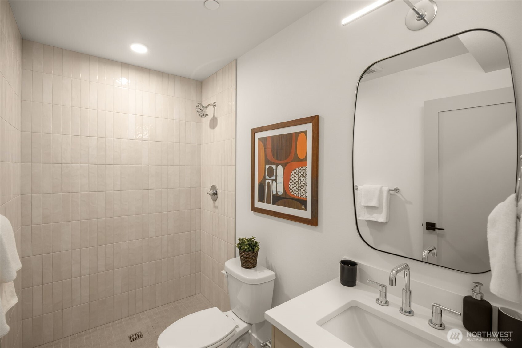 The full bath on the ground level makes an excellent private secondary suite