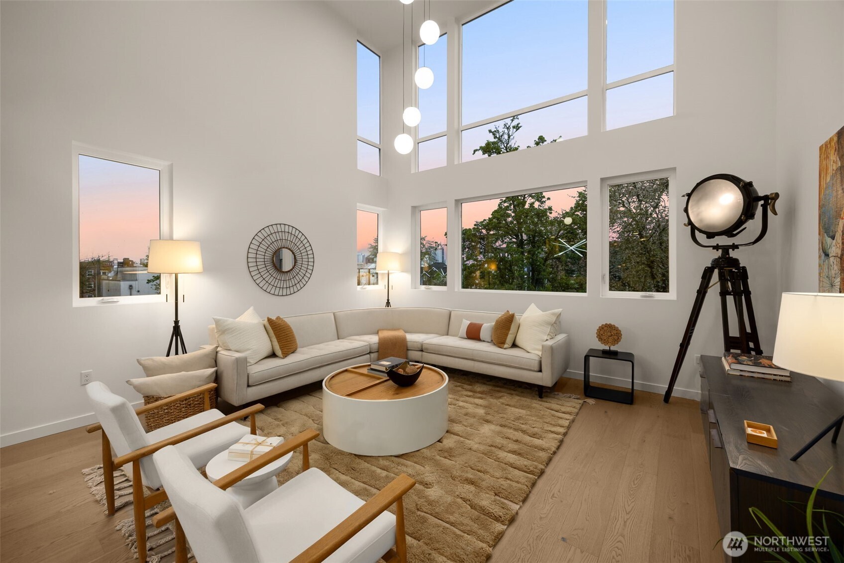 Massive walls of windows keep the home bright & airy