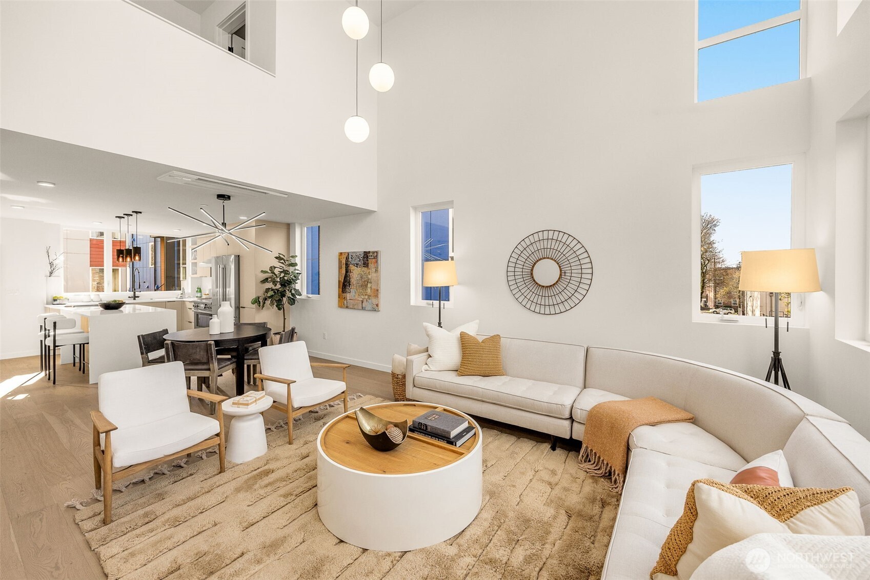 Soaring double-height ceilings and mezzanine levels create a sense of scale and volume.