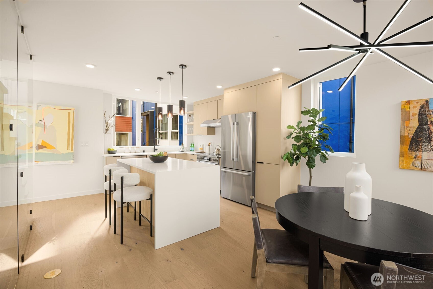 A stunning focal point: The massive 3cm quartz waterfall island in the chef's kitchen.