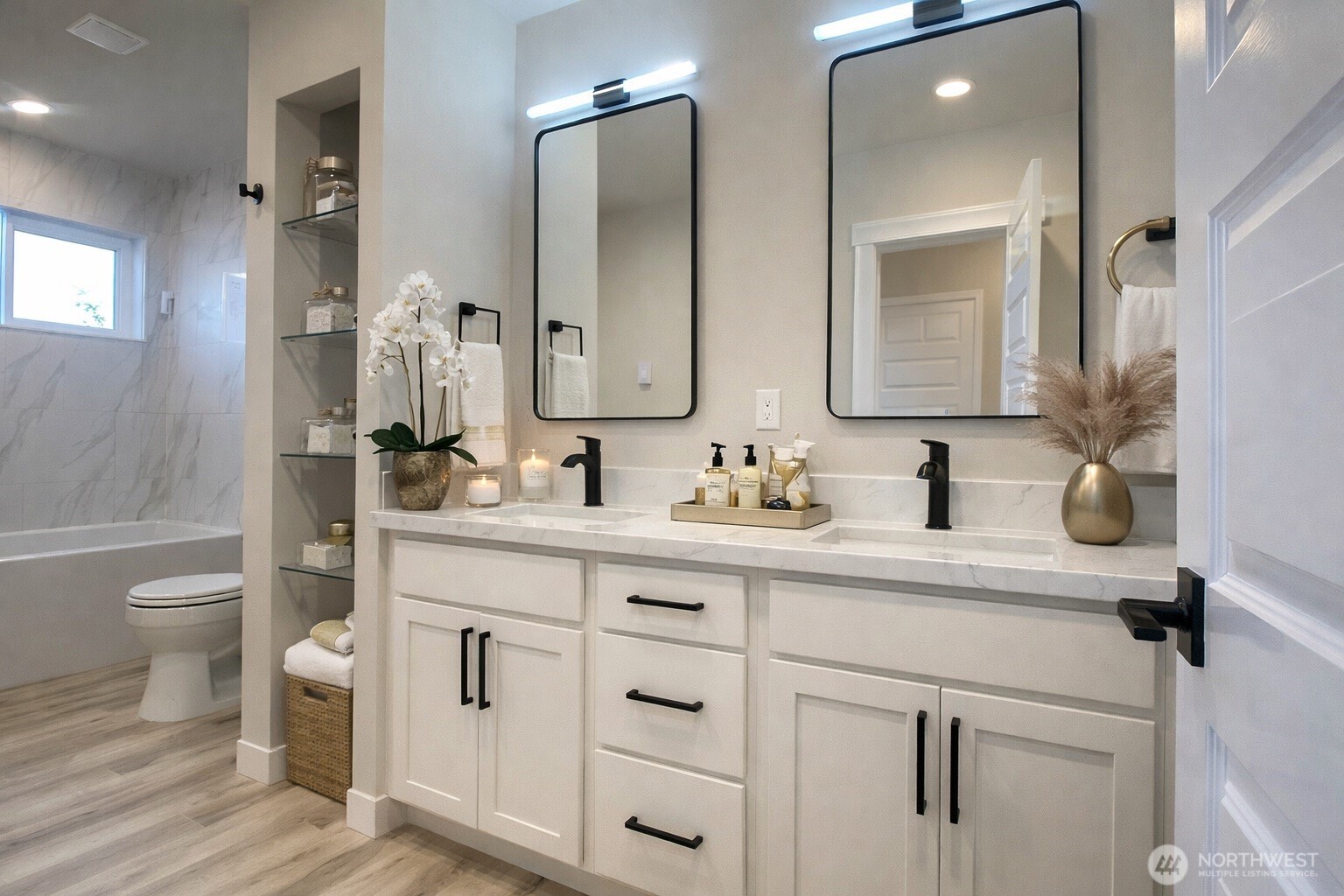 Primary bth. Bath side. Behind the door is another stand in shower. pic virtually enhanced