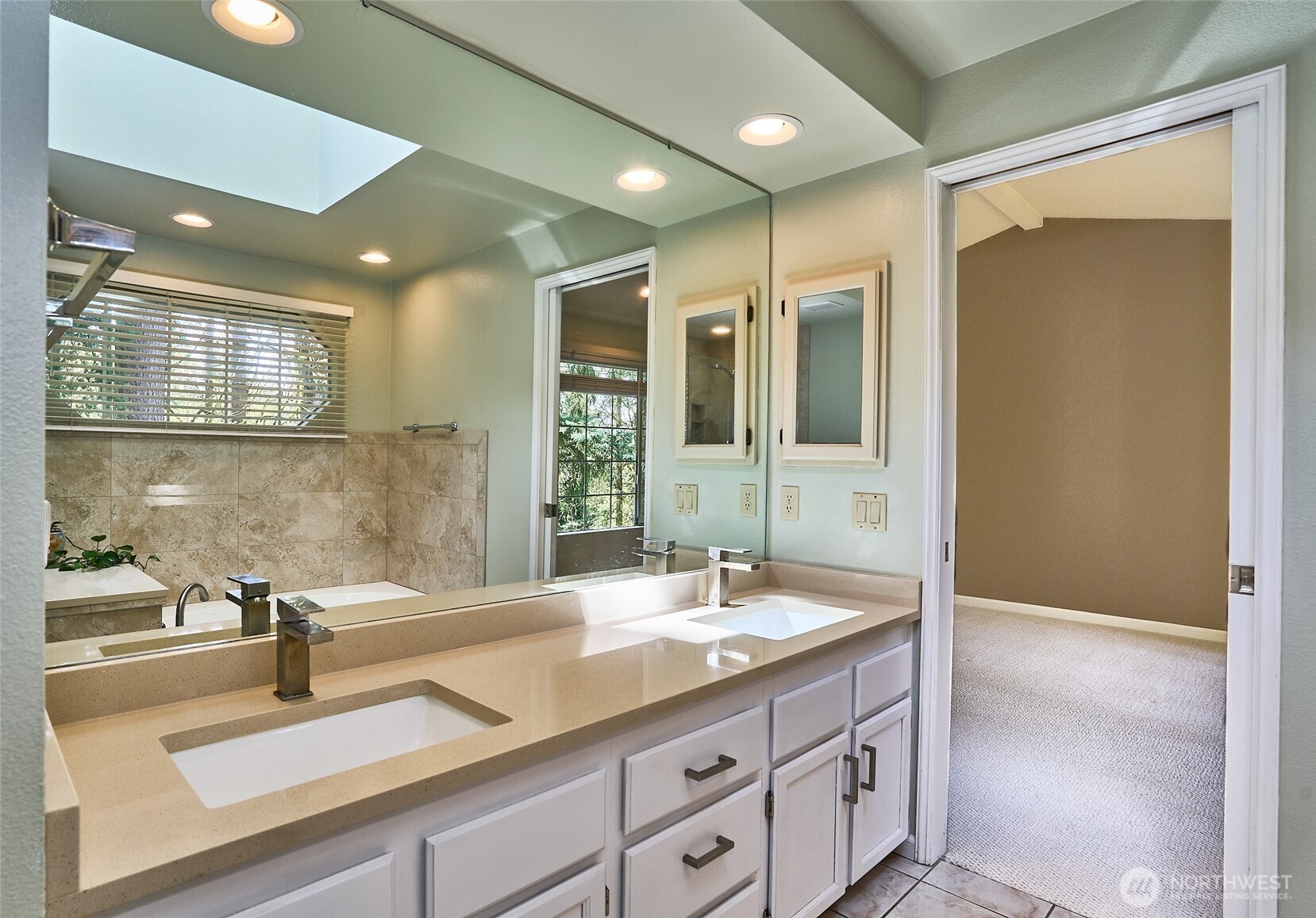 The primary en suite features double vanity with quartz counter top.