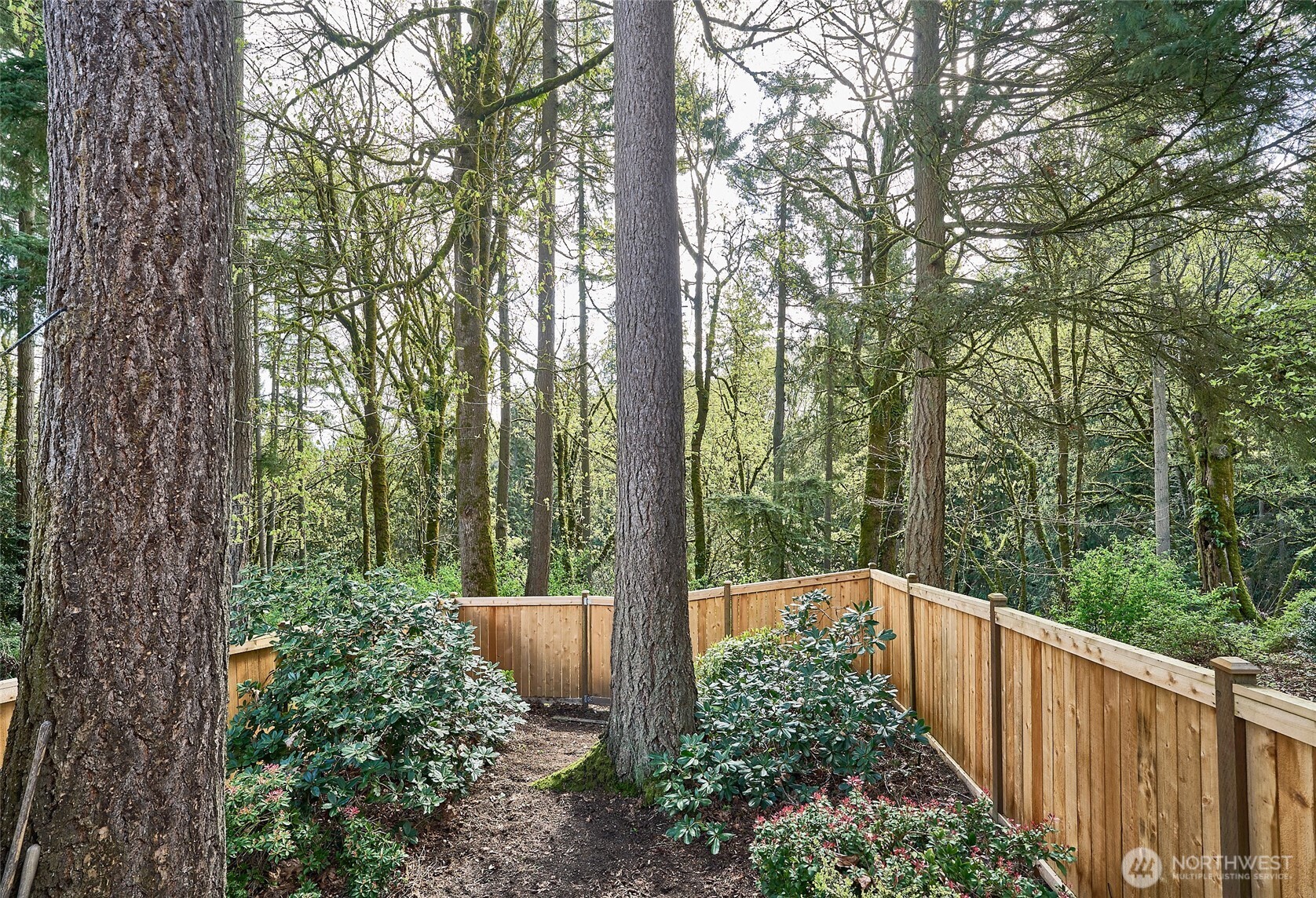 This home and deck looks out into this beautiful permanent greenbelt.