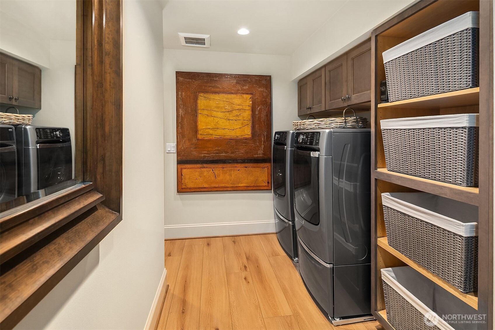Laundry area with ample storage for extra downstairs linens and towels