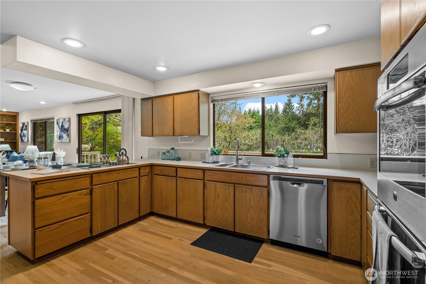 The kitchen blends style and function with hardwood cabinetry and stainless appliances sure to please the household chef!