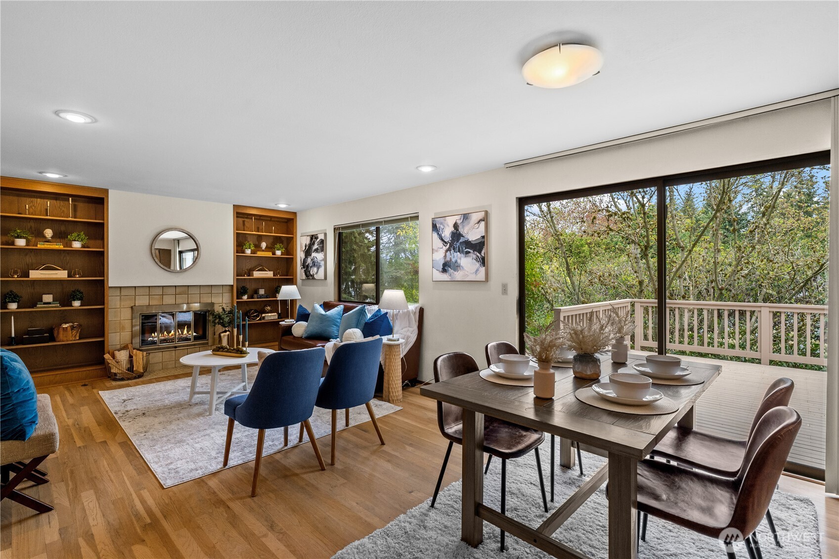 A cozy family room fireplace invites you to relax and features easy access to a large entertainment deck.