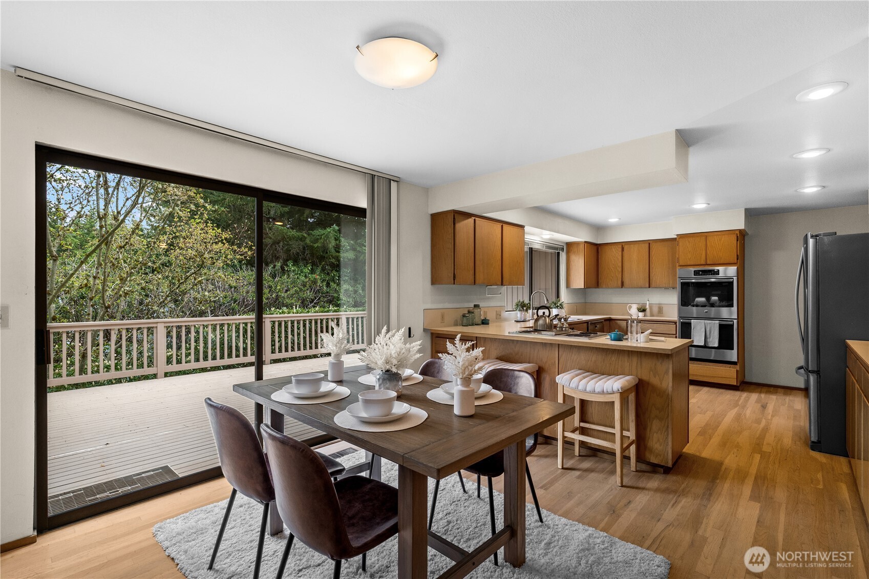 Large slider door steps out to the deck extending your entertainment space to the outdoors.