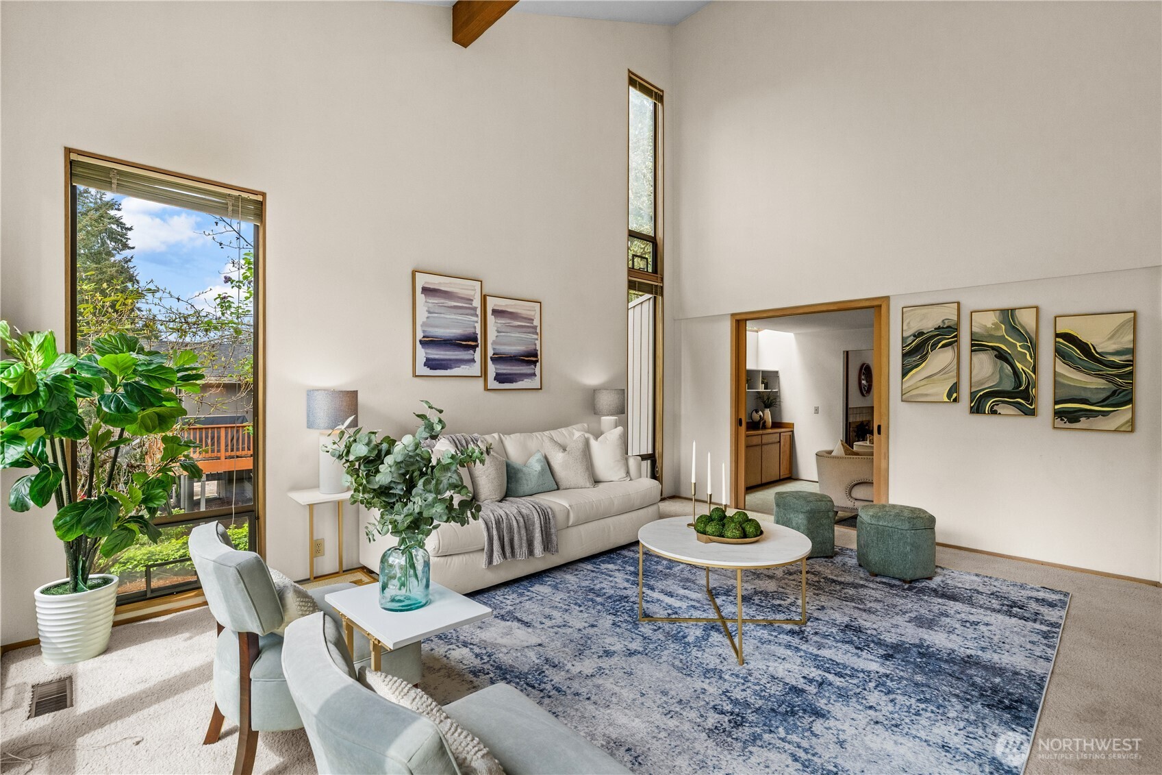 You'll fall in love with this inviting living room...it's light and bright, spacious and accommodating for your every need.   Furnish in traditional style or capture a mid-century vibe! In the background a den..or....