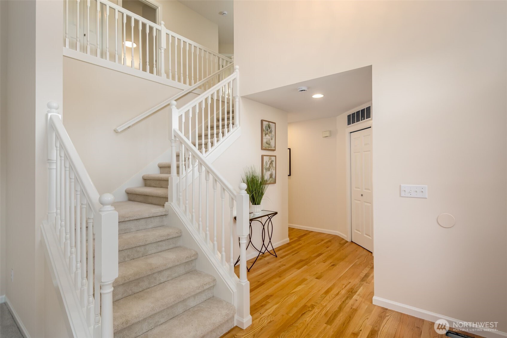 When you reach the top of the stairs, you'll find the double door entry primary bedroom.