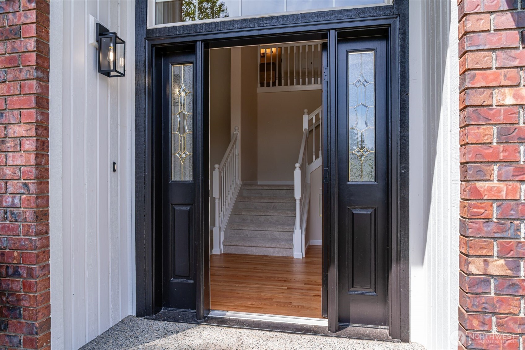 Step inside.  The 2-story entry adjacent to the living room.