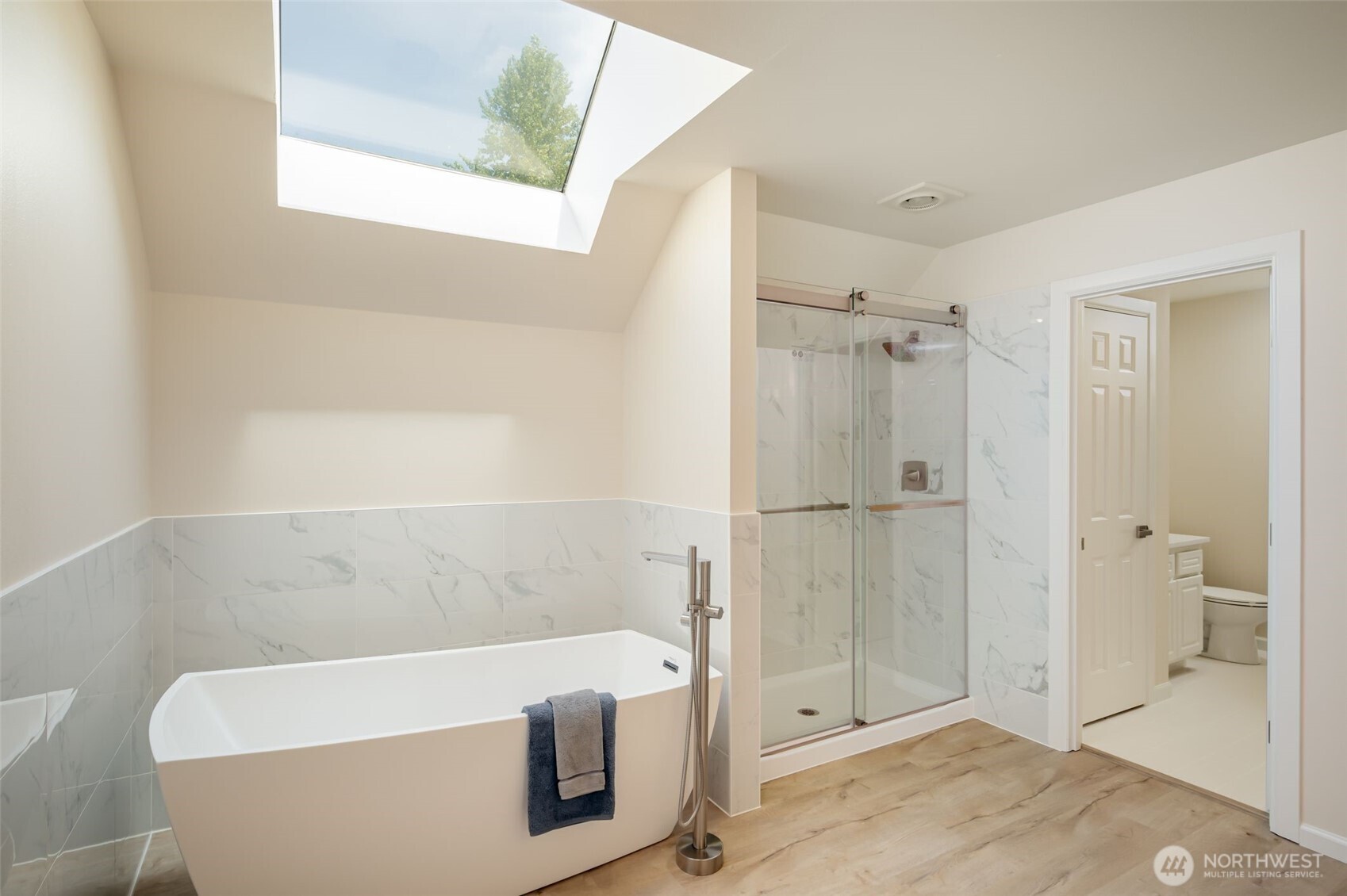You'll love the beautiful new shower and soaking tub.  The shower features tiled walls and a convenient niche for shampoo, conditioner, and soap.