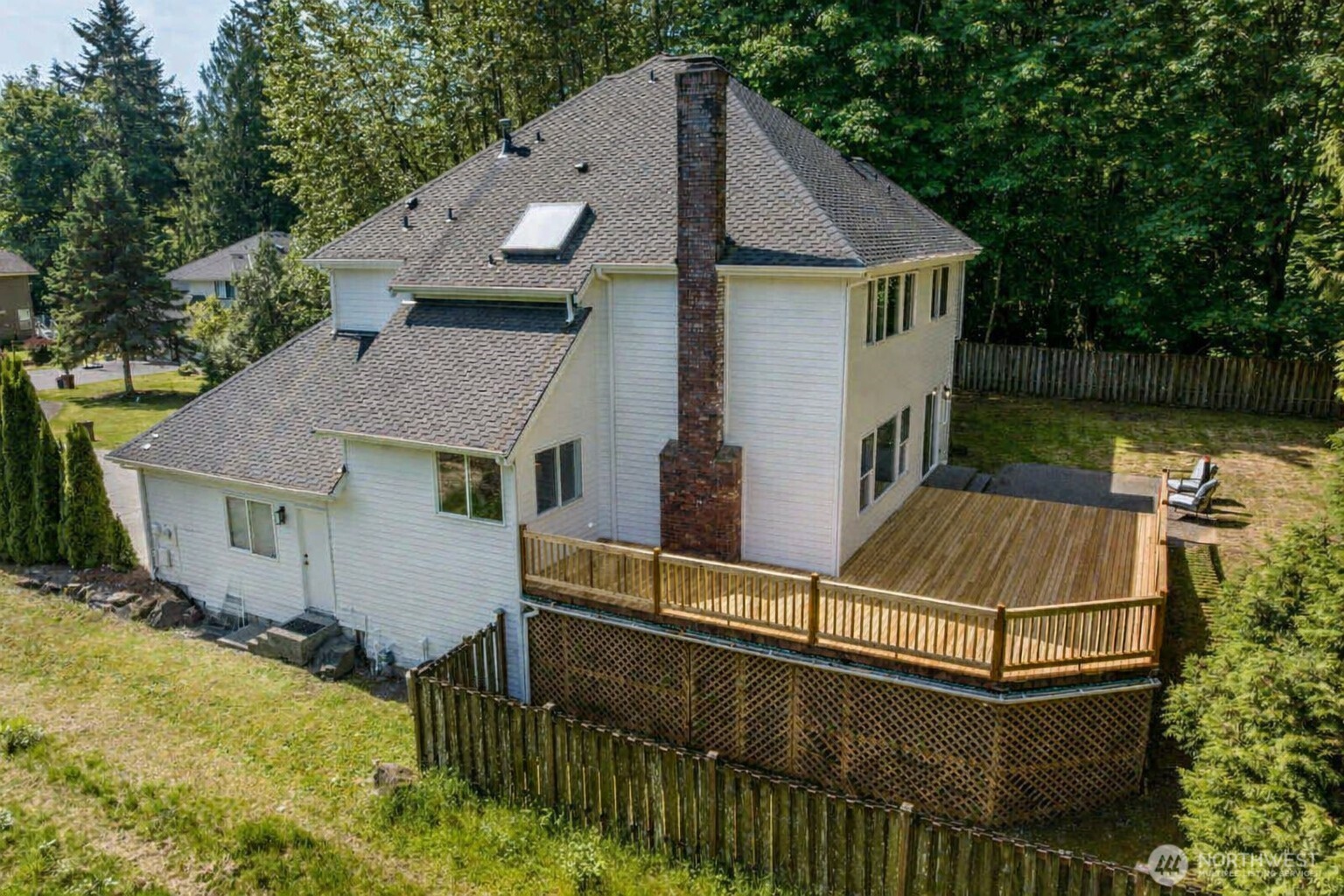Nice view of the backyard patio and deck.  Notice the duck pond just beyond the deck.  Great place to observe nature!
