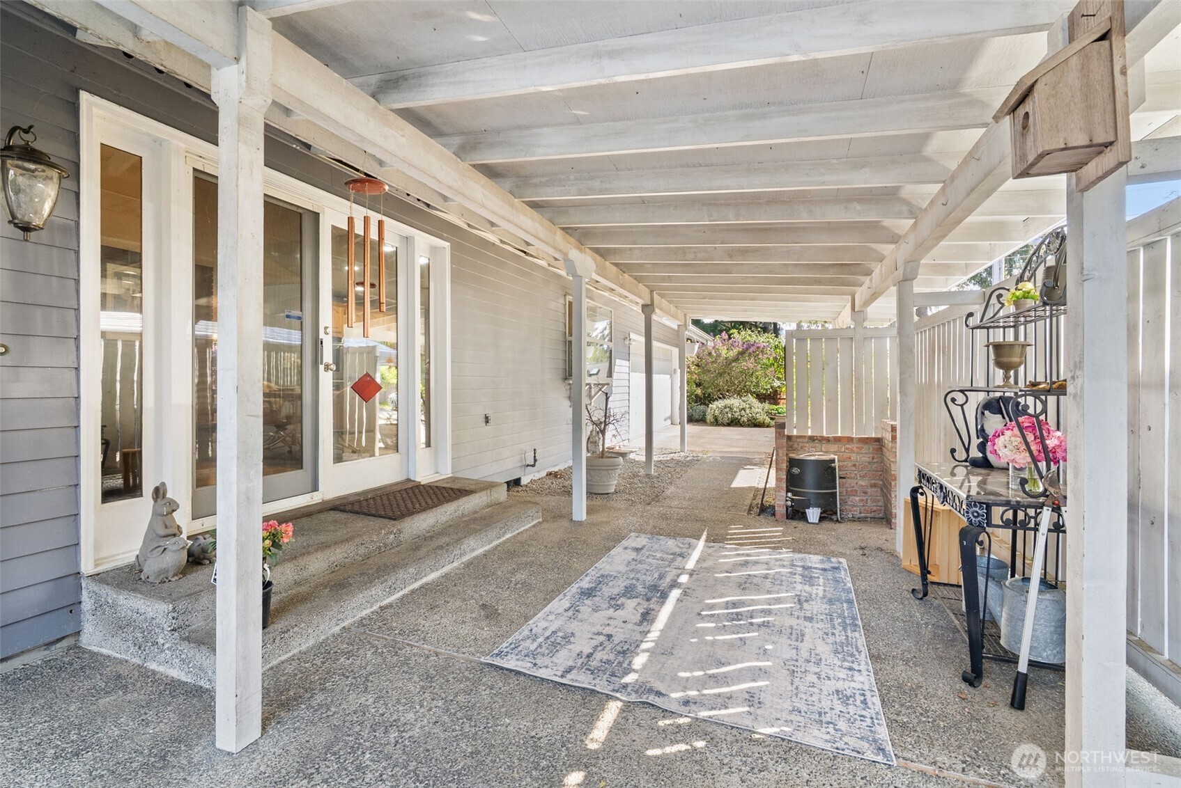 Covered patio and rear entry to the home