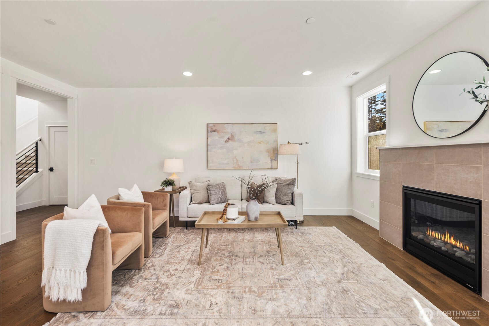 Main Living Overview:  Wide sightlines connect the kitchen, dining area, and great room, emphasizing natural light from multiple windows and the warm tones of the engineered hardwoods. This open-concept layout offers exceptional flexibility for furniture placement and comfortable living. Located in Bothell’s Canyon Park area, the home provides quick access to shopping, Northshore schools, and major commuting routes, making day-to-day life both convenient and connected. The scale of the space lends itself beautifully to hosting, creating room for gatherings of all types while maintaining a clean, modern aesthetic.    These photos are from Lot 5 at Gooden Hollow, the community model. The home listed will have changes, so all photos, renderings, site maps, and floorplans are for visualization purposes only. Plans, colors, building orientation, finishes, home outlook, and other details can and WILL vary.