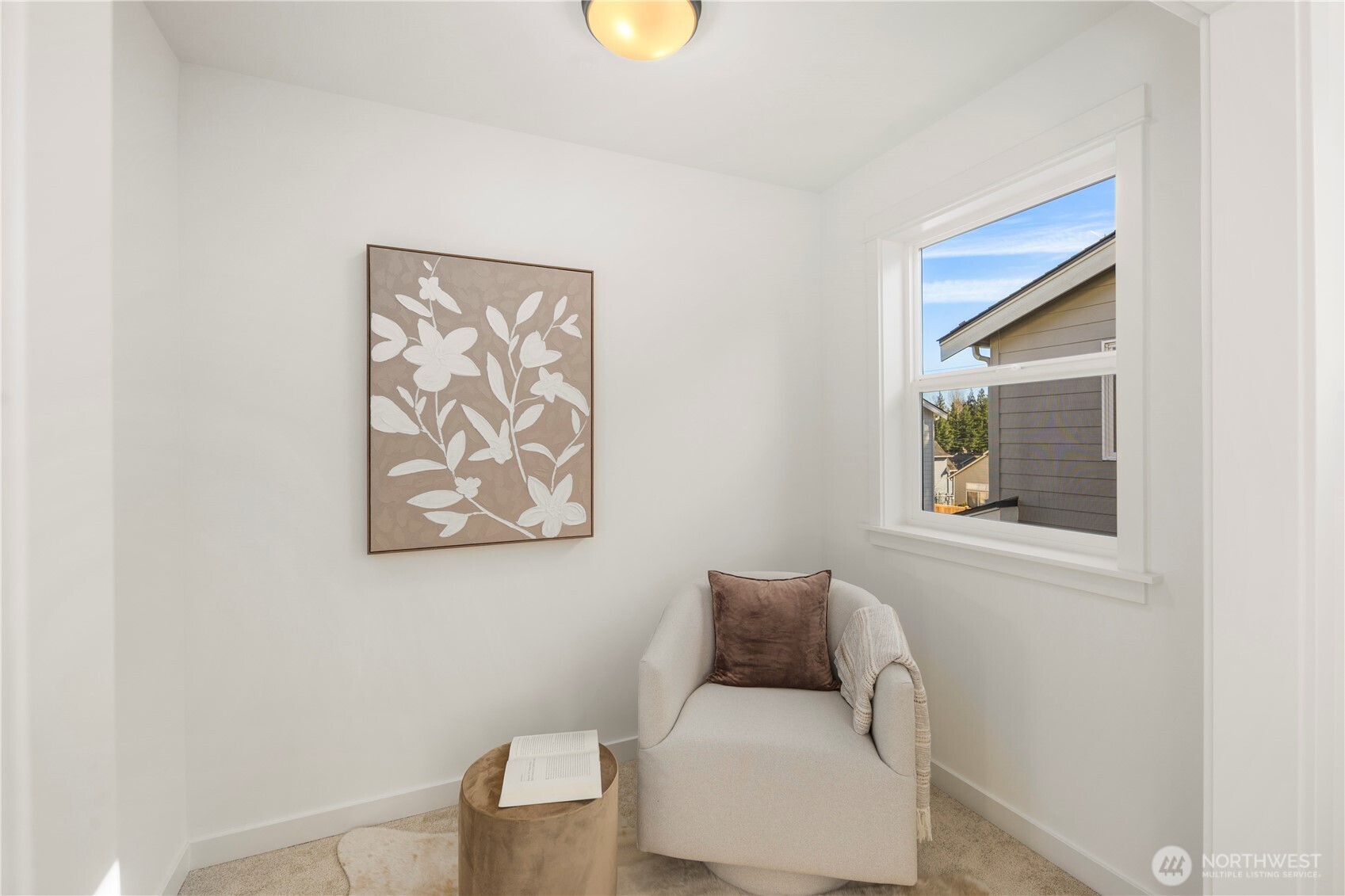 Primary Suite Sitting Room:  The sitting room within the primary suite offers a quiet, light-filled alcove framed by clean lines and soft carpeting. Its separation from the main sleeping area makes it ideal for reading, meditation, or simply enjoying a private corner of the home. Positioned in the heart of Bothell’s Canyon Park corridor, this added space reflects the community’s blend of comfort and modern livability. The versatility of this area gives the suite a richer, more elevated feel, allowing you to create a retreat that feels truly personal.    These photos are from Lot 5 at Gooden Hollow, the community model. The home listed will have changes, so all photos, renderings, site maps, and floorplans are for visualization purposes only. Plans, colors, building orientation, finishes, home outlook, and other details can and WILL vary.
