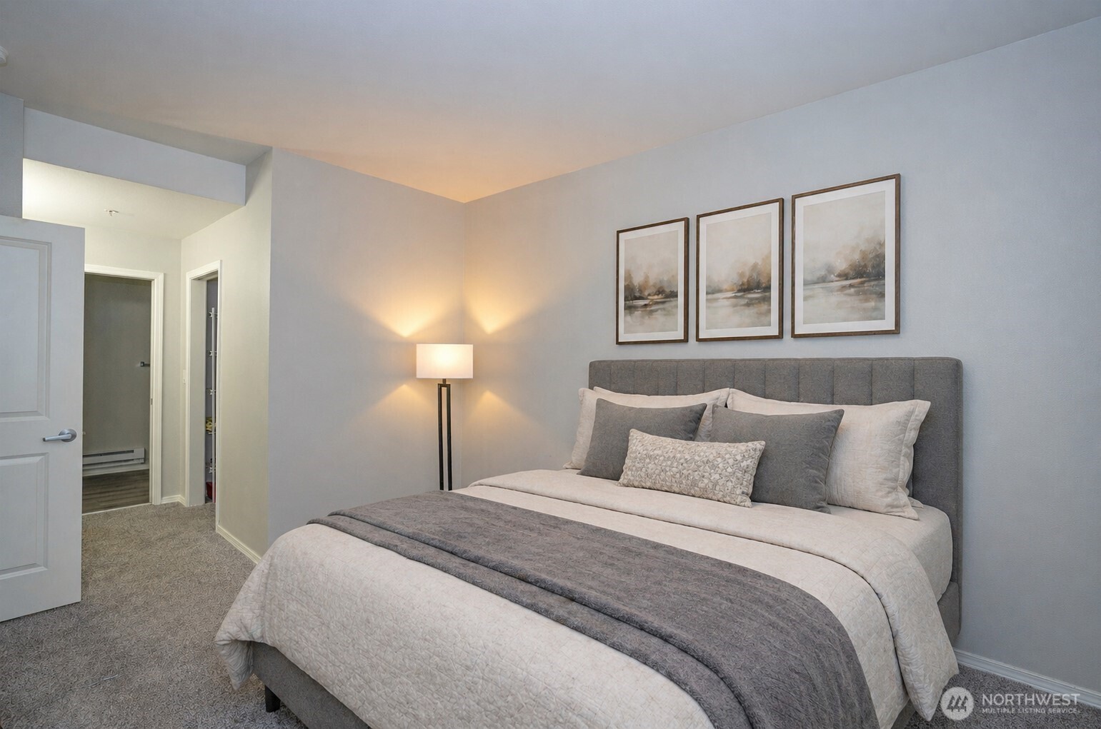 Alternate view of the primary suite highlighting its spacious, light-filled design.