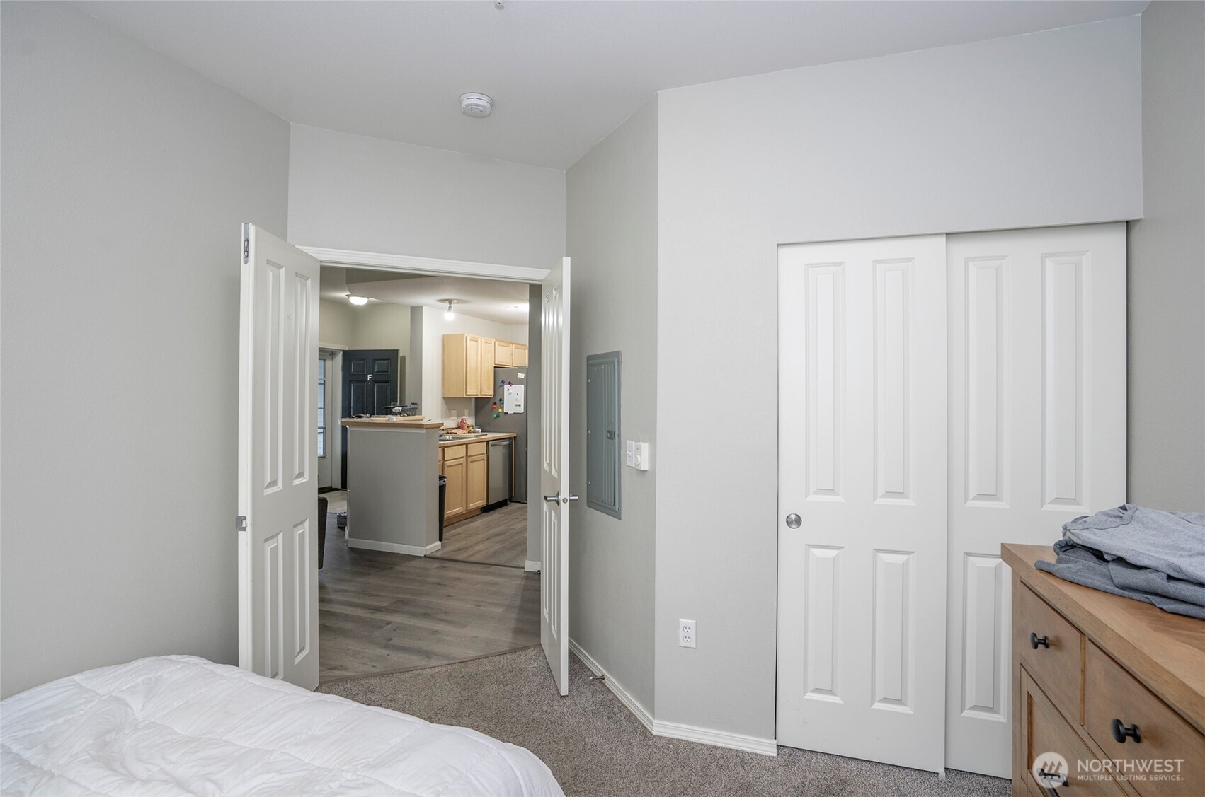 Another view of the guest suite featuring double-door entry—an ideal flexible space for a home office or den.