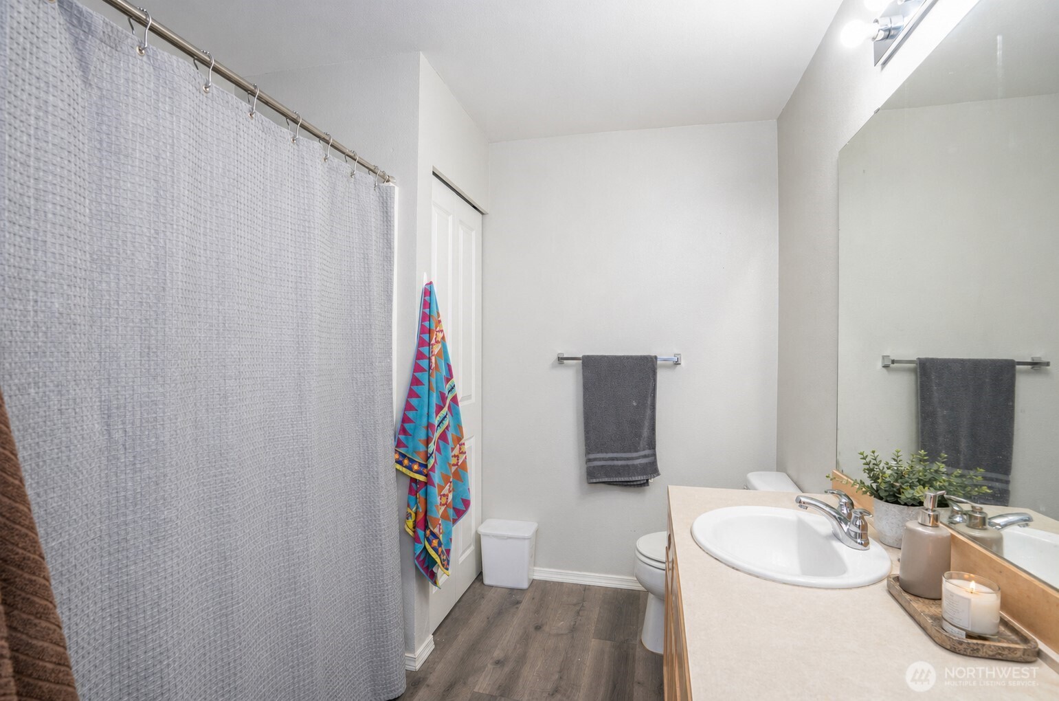 Alternate view of the guest bathroom showcasing its clean and functional design.