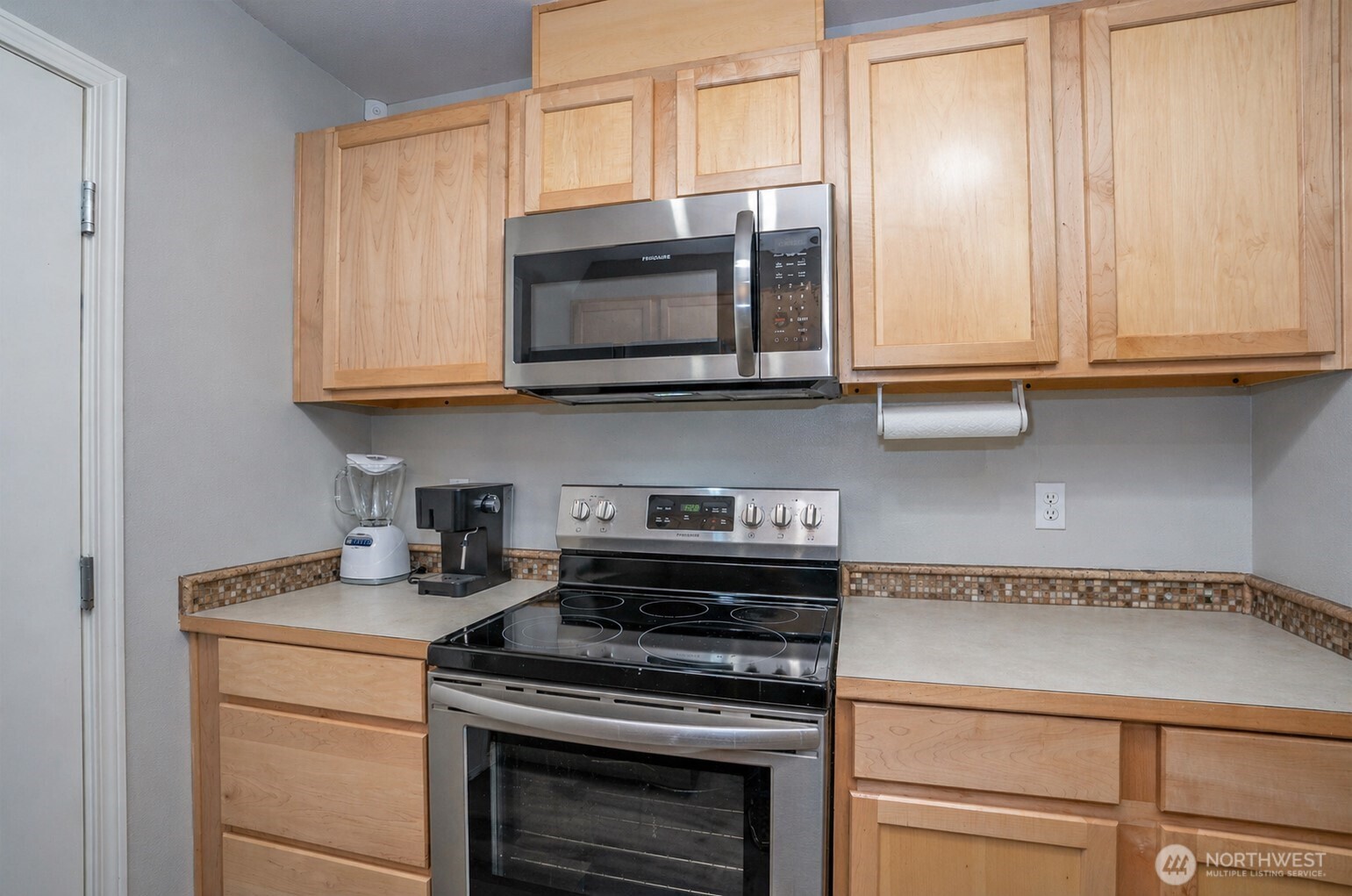 Alternate view of the kitchen highlighting its layout and features.