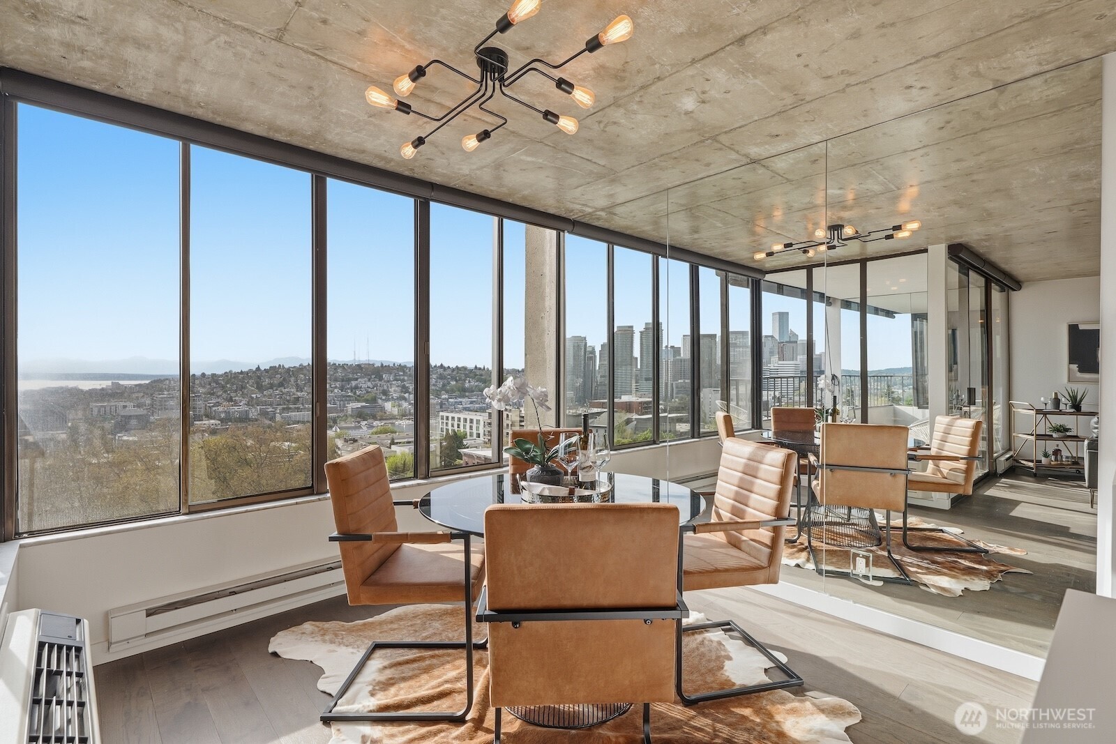 Mirrored walls increase the brightness of this space and add to the open, airy feel - so chic!
