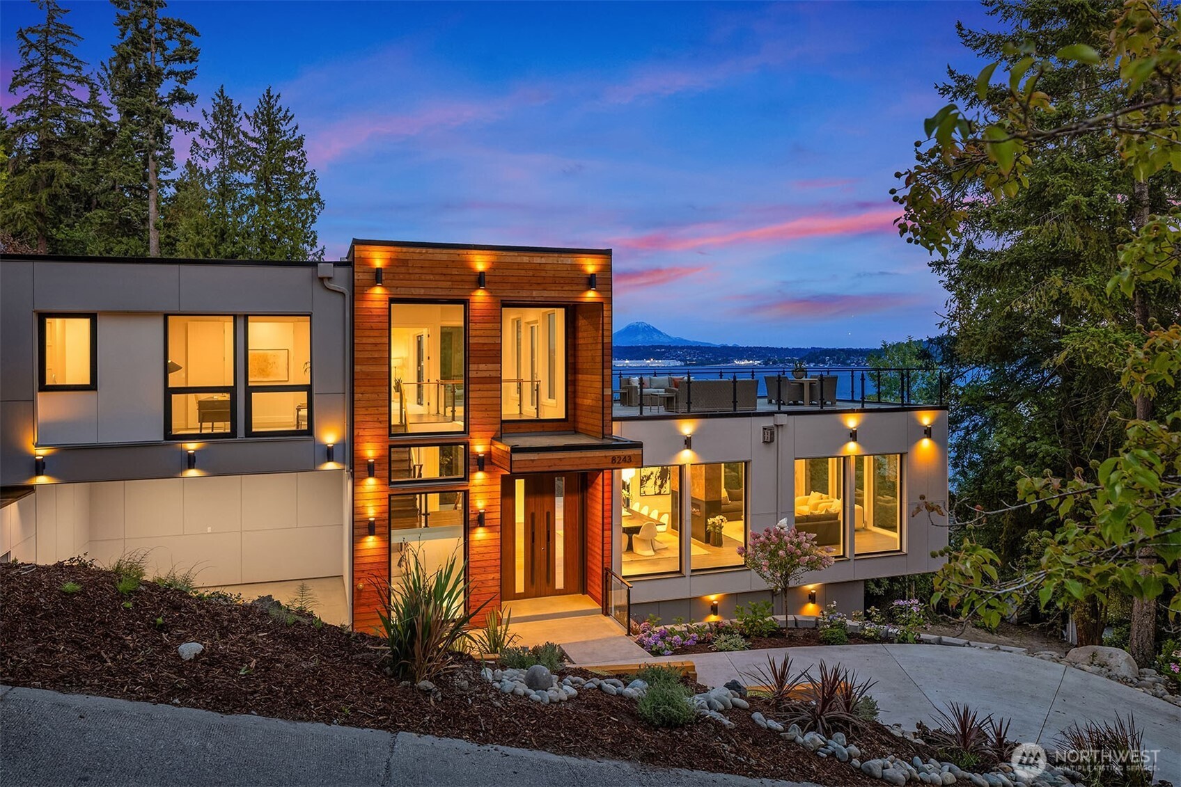 Striking modern design, glowing at sunset, with sweeping views over Lake Washington and Mount Rainier.